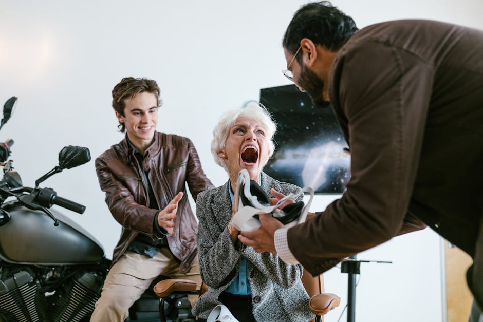 An excited senior woman experiencing virtual reality with the help of two young men indoors.